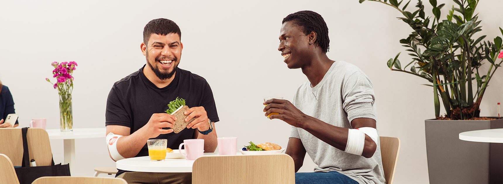 two men having a snack at blood donation